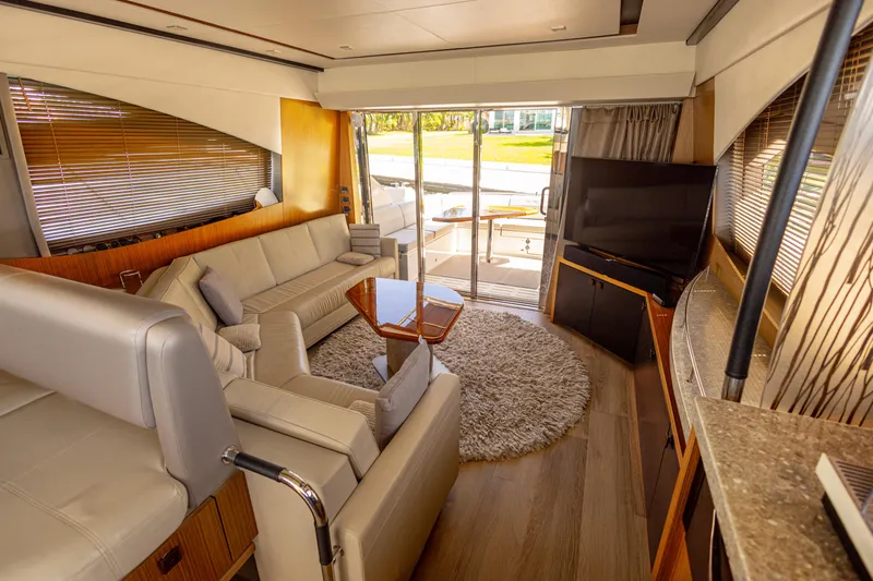 2018 Sea Ray L590 @ Cancun Yacht Photos Pics Luxurious interior of 2018 Sea Ray L590 yacht with modern furnishings and large windows.