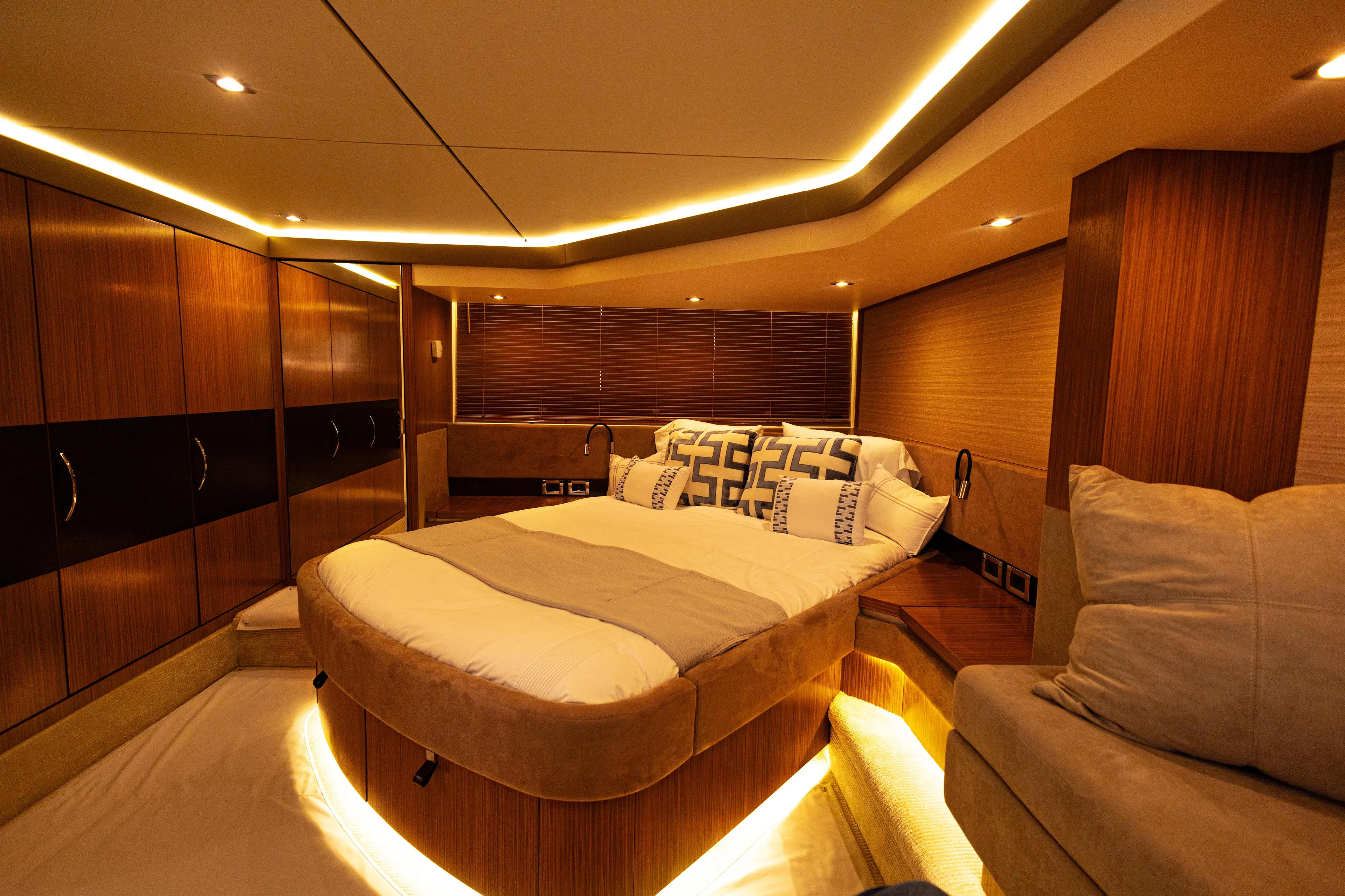 2018 Sea Ray L590 @ Cancun Yacht Photos Pics Luxurious interior of 2018 Sea Ray L590 yacht with elegant lighting and cozy bedding.