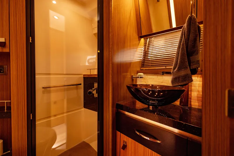 2018 Sea Ray L590 @ Cancun Yacht Photos Pics Luxurious bathroom interior of 2018 Sea Ray L590 yacht with modern fixtures and elegant design.