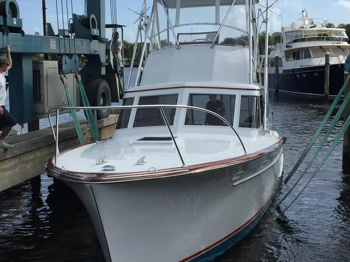 Uncle Jack Yacht Photos Pics 1965 Rybovich 37 Sportfish boat docked at marina, ready for fishing adventure.