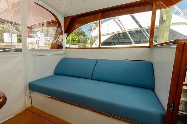 Uncle Jack Yacht Photos Pics Blue cushioned seating on 1965 Rybovich 37 Sportfish boat interior.