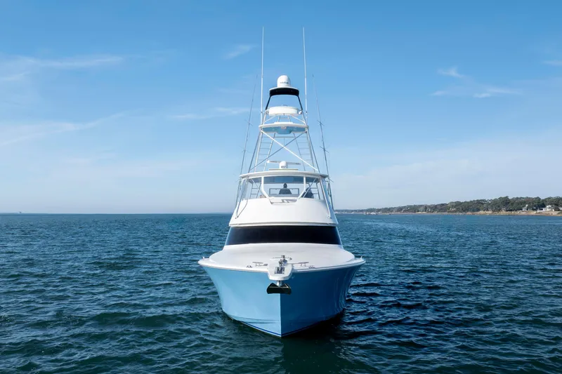Reel Developers Yacht Photos Pics 2009 Viking 60 Convertible yacht on open water, clear sky background.
