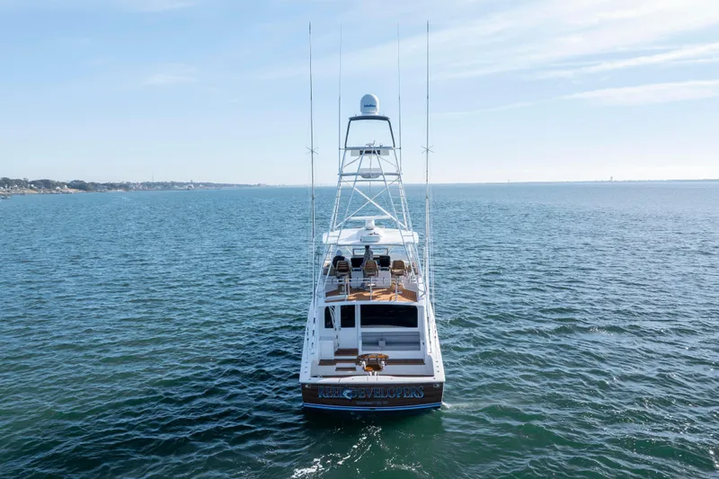 Reel Developers Yacht Photos Pics 2009 Viking 60 Convertible yacht on open water, rear view.