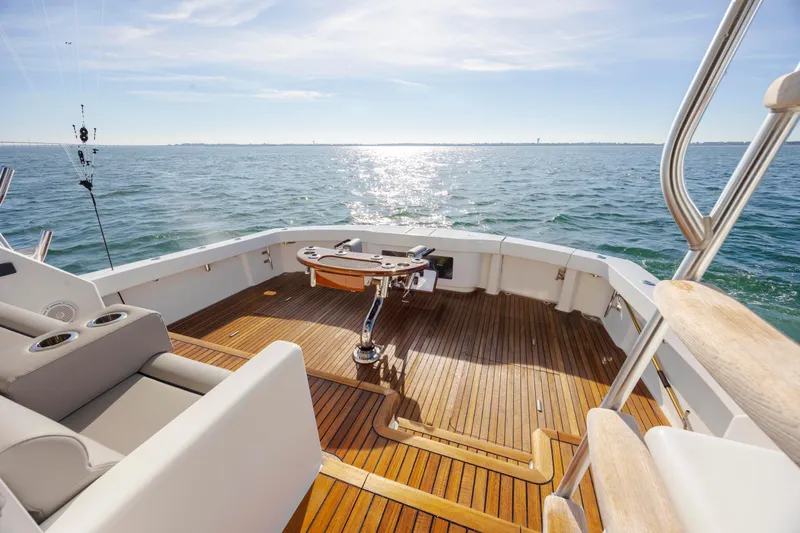 Reel Developers Yacht Photos Pics 2009 Viking 60 Convertible yacht deck with ocean view and fishing setup.