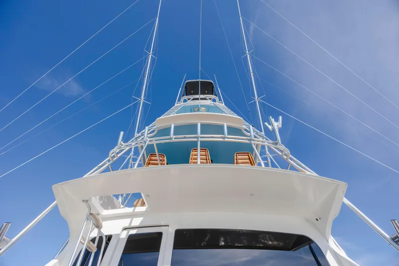 Reel Developers Yacht Photos Pics 2009 Viking 60 Convertible yacht, viewed from below against a clear blue sky.