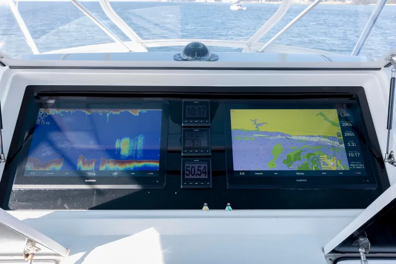 Reel Developers Yacht Photos Pics Dashboard of a 2009 Viking 60 Convertible yacht with Garmin navigation displays.