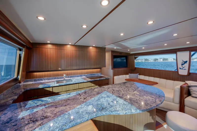 Reel Developers Yacht Photos Pics Luxurious interior of 2009 Viking 60 Convertible yacht with elegant wood and granite finishes.