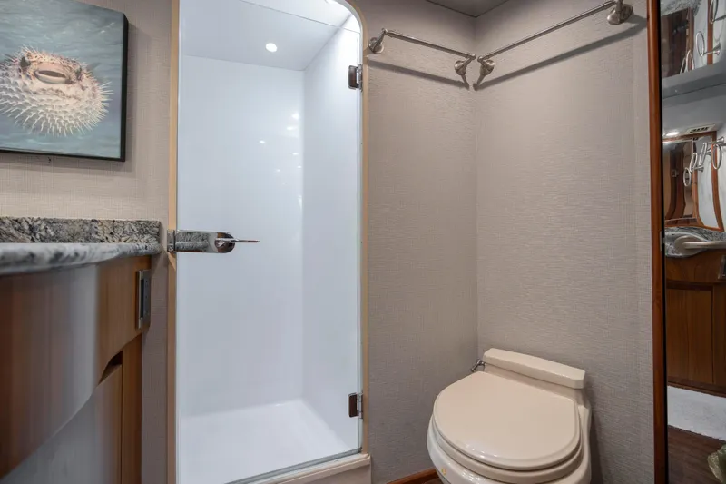 Reel Developers Yacht Photos Pics Luxurious bathroom in 2009 Viking 60 Convertible yacht with modern shower and toilet.