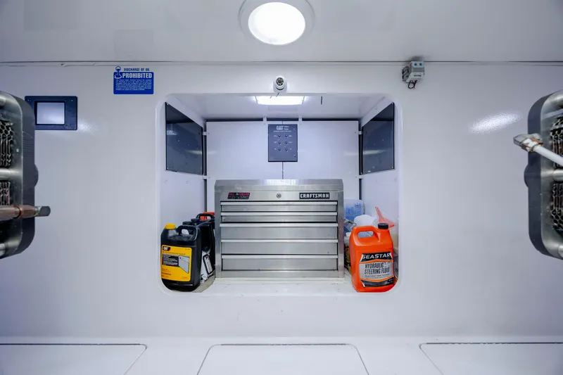 Reel Developers Yacht Photos Pics Engine room of 2009 Viking 60 Convertible with tool chest and fluid containers.