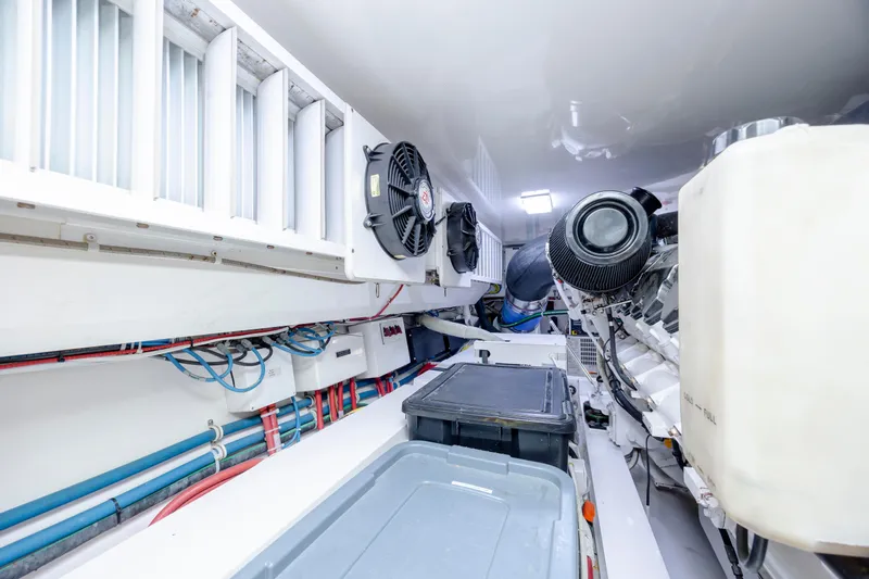 Reel Developers Yacht Photos Pics Engine room of 2009 Viking 60 Convertible yacht, showcasing machinery and ventilation systems.