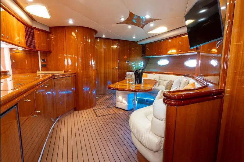  Yacht Photos Pics Luxurious interior of 2000 Sunseeker Predator 60 yacht with polished wood and plush seating.