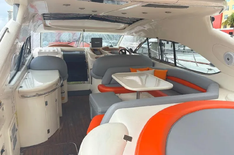  Yacht Photos Pics Interior of 2000 Sunseeker Predator 60 yacht with modern seating and dining area.