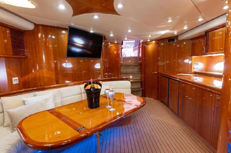  Yacht Photos Pics Luxurious interior of 2000 Sunseeker Predator 60 yacht with elegant wood finish and modern amenities.