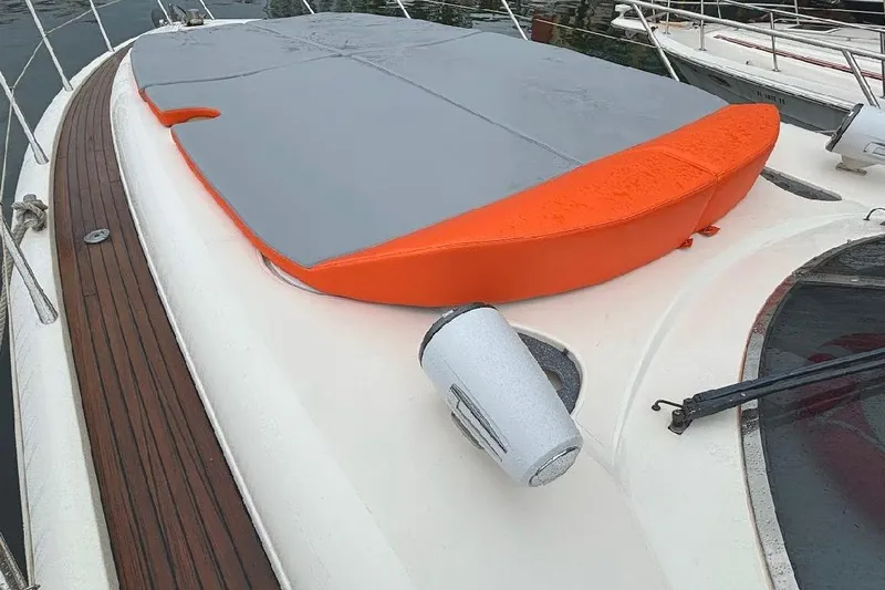  Yacht Photos Pics Sunseeker Predator 60 yacht deck with orange and gray cover, 2000 model.