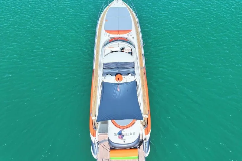  Yacht Photos Pics Aerial view of 2000 Sunseeker Predator 60 yacht on turquoise water.