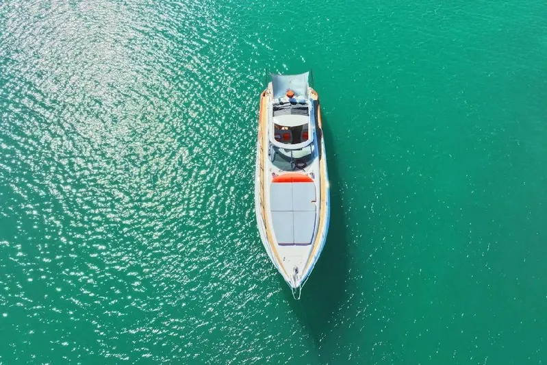  Yacht Photos Pics Aerial view of 2000 Sunseeker Predator 60 yacht on turquoise water.