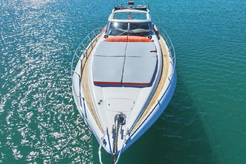  Yacht Photos Pics Sunseeker Predator 60 yacht, 2000 model, cruising on sparkling blue water.