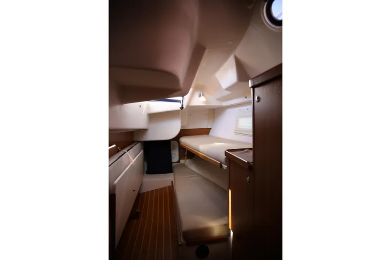 Platypus Yacht Photos Pics Interior cabin of 2014 Catalina 445 sailboat, featuring cozy sleeping quarters and wooden finishes.