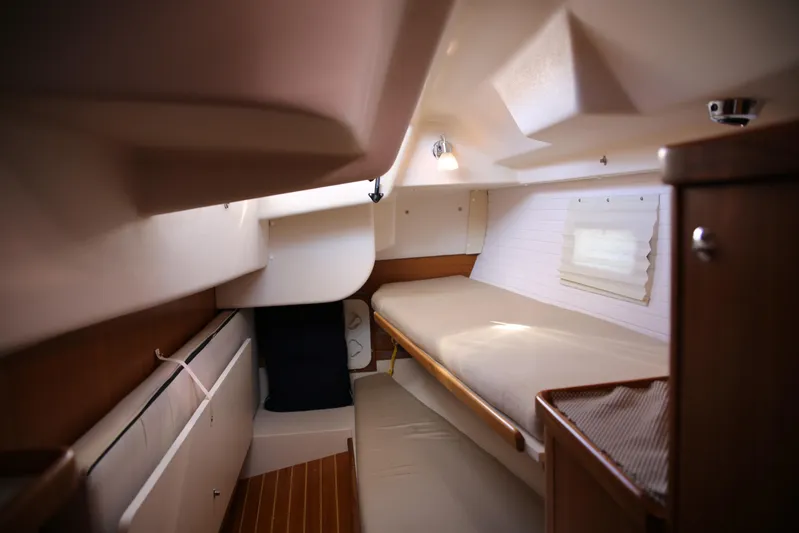 Platypus Yacht Photos Pics 2014 Catalina 445 yacht interior cabin with wooden finishes and cozy sleeping area.