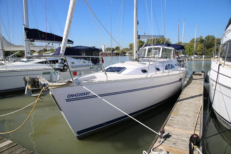 Platypus Yacht Photos Pics 2014 Catalina 445 sailboat docked at marina under clear blue sky.