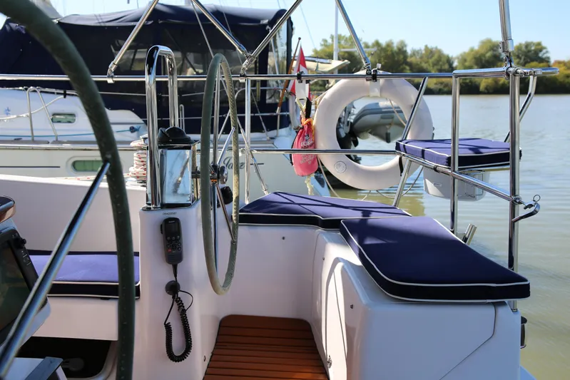 Platypus Yacht Photos Pics Cockpit of 2014 Catalina 445 sailboat with blue cushions and steering wheel.