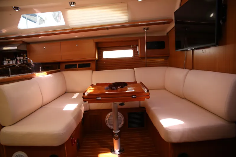 Platypus Yacht Photos Pics Luxurious interior of 2014 Catalina 445 yacht with cozy seating and wooden accents.