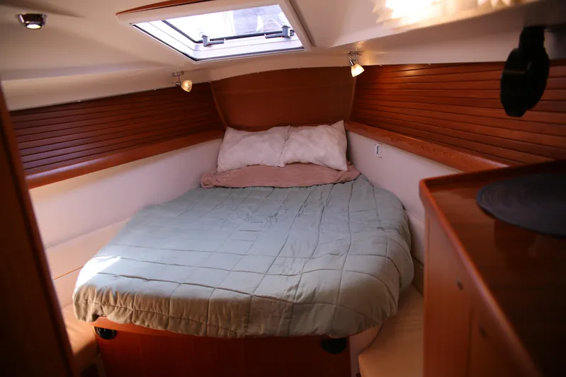 Platypus Yacht Photos Pics Cozy cabin interior of 2014 Catalina 445 sailboat with skylight and wooden paneling.