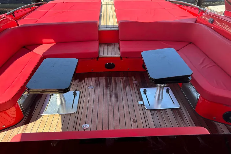  Yacht Photos Pics Luxurious 2015 SACS Strider 19 yacht interior with red seating and wooden flooring.