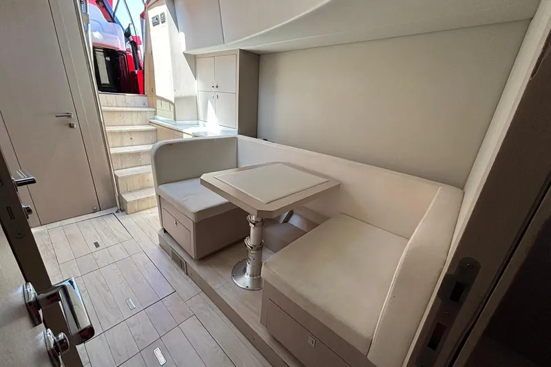  Yacht Photos Pics Luxurious interior of 2015 SACS Strider 19 yacht with elegant seating and table.