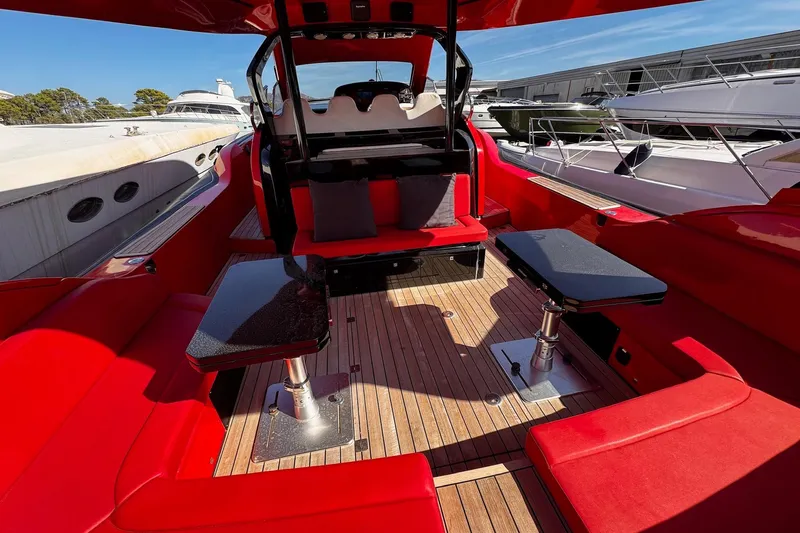  Yacht Photos Pics Luxurious 2015 SACS Strider 19 yacht interior with vibrant red seating and sleek design.