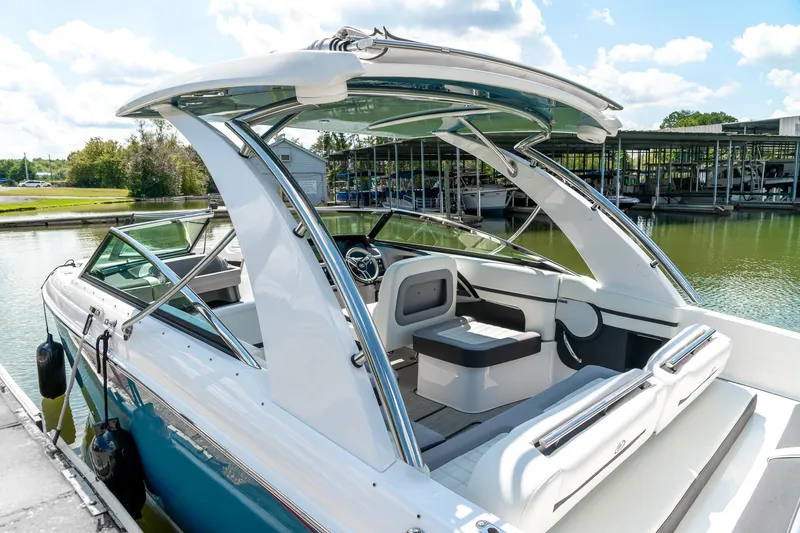  Yacht Photos Pics 2023 Cobalt R30 boat docked, showcasing sleek design and spacious seating.