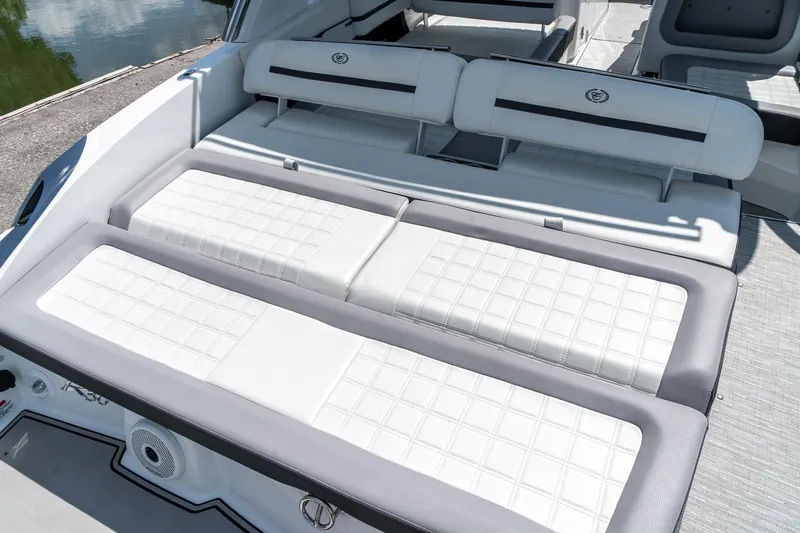  Yacht Photos Pics 2023 Cobalt R30 boat interior with white cushioned seating and sleek design.