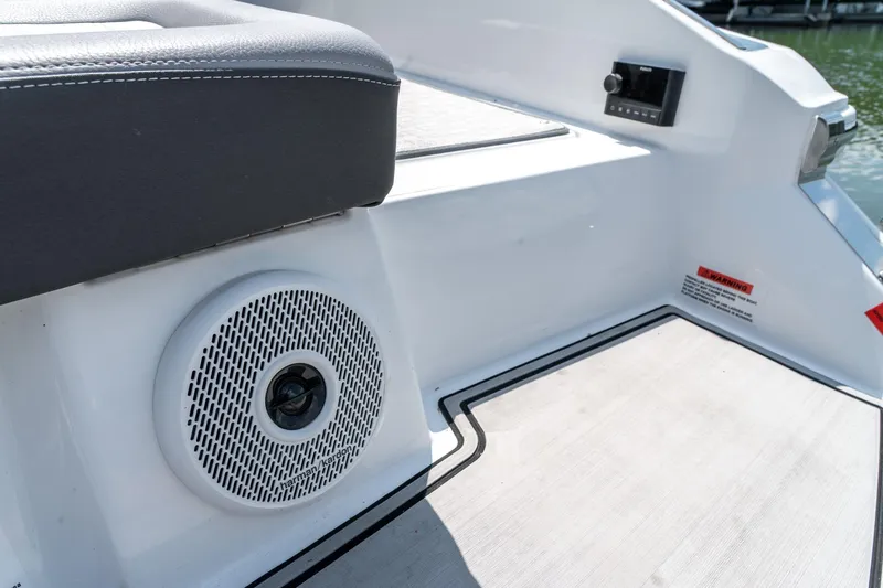  Yacht Photos Pics 2023 Cobalt R30 boat interior with speaker and control panel.