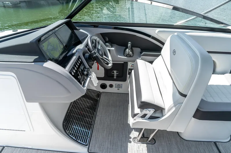  Yacht Photos Pics 2023 Cobalt R30 boat cockpit with modern steering and navigation system.