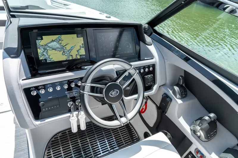  Yacht Photos Pics 2023 Cobalt R30 boat dashboard with Garmin navigation and modern controls.