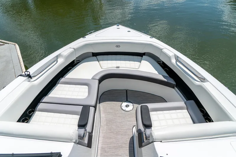  Yacht Photos Pics 2023 Cobalt R30 boat interior with luxurious seating on calm water.