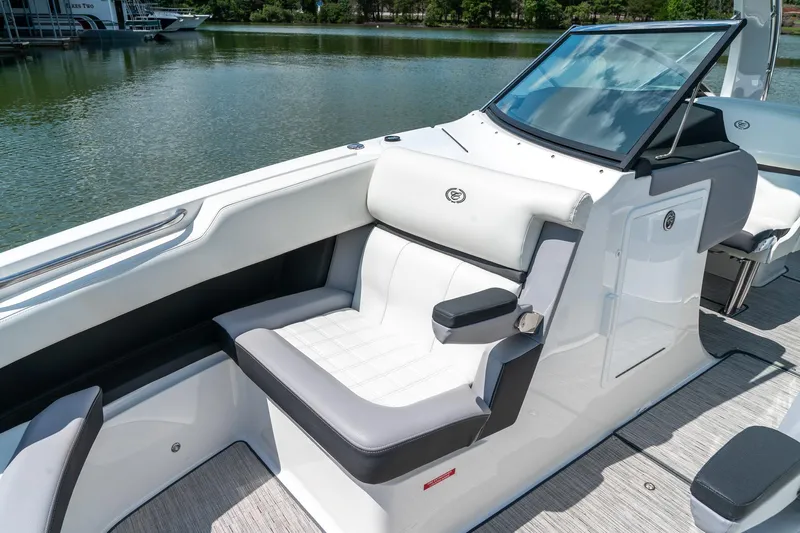  Yacht Photos Pics 2023 Cobalt R30 boat interior with luxurious seating and sleek design on a calm lake.