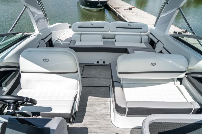 Yacht Photos Pics 2023 Cobalt R30 boat interior with luxurious white seating and modern design.