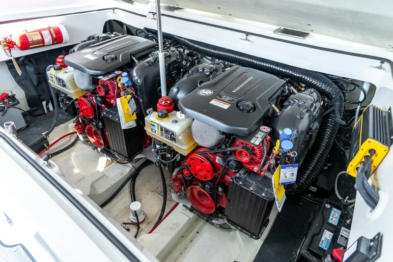  Yacht Photos Pics 2023 Cobalt R30 engine compartment with dual Volvo Penta engines and fire extinguisher.