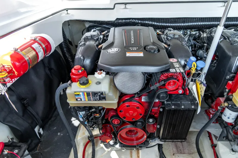  Yacht Photos Pics 2023 Cobalt R30 engine compartment with Volvo Penta engine and fire extinguisher.