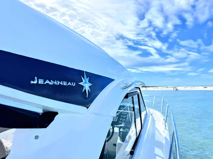 Ganesha Yacht Photos Pics 2016 Jeanneau 36 Leader boat on calm water under a clear blue sky.