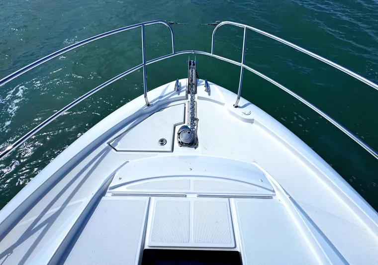 Ganesha Yacht Photos Pics Bow view of 2016 Jeanneau 36 Leader boat on water.