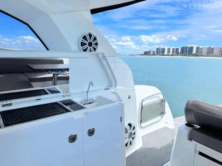 Ganesha Yacht Photos Pics Jeanneau 36 Leader 2016 yacht interior with kitchenette, ocean view, and modern design.