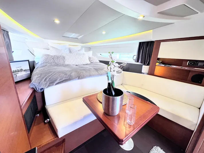 Ganesha Yacht Photos Pics Luxurious interior of 2016 Jeanneau 36 Leader yacht with cozy seating and elegant decor.