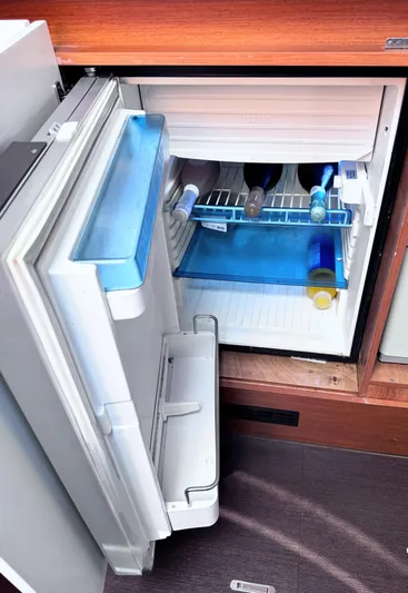 Ganesha Yacht Photos Pics Open fridge with bottles inside on Jeanneau 36 Leader 2016 boat.