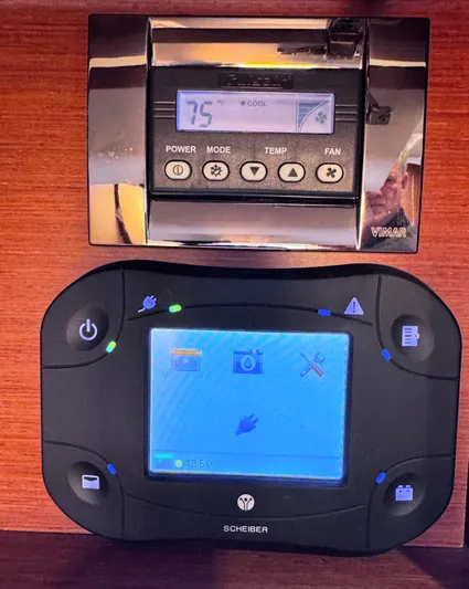 Ganesha Yacht Photos Pics Control panels on a 2016 Jeanneau 36 Leader boat, featuring temperature and system displays.