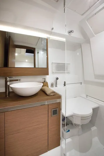 Ganesha Yacht Photos Pics Modern bathroom in 2016 Jeanneau 36 Leader yacht with sleek design and wooden cabinetry.