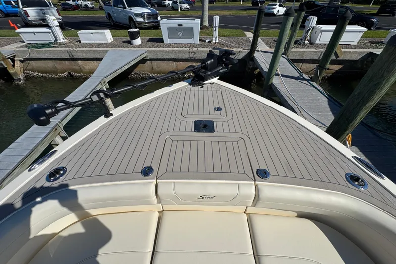  Yacht Photos Pics 2025 Scout 281 XSS boat bow with seating and deck at a marina dock.