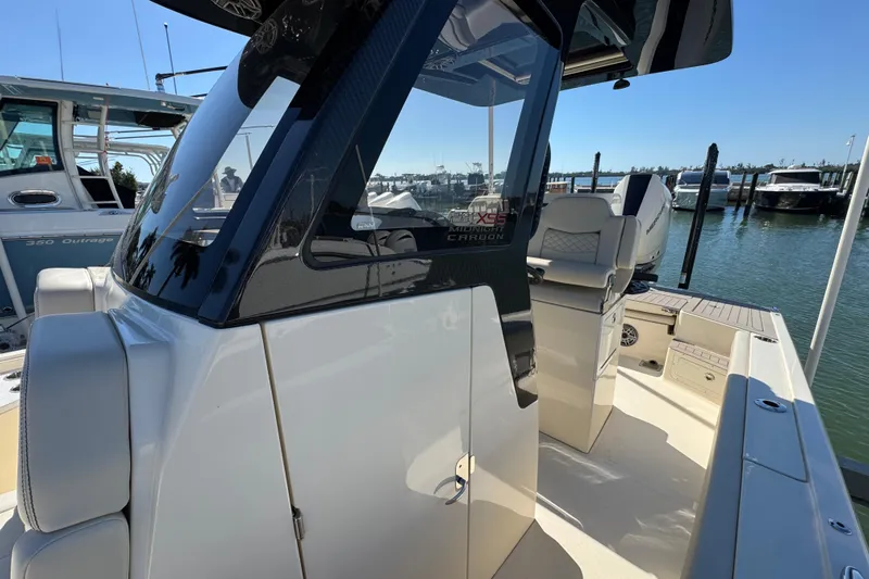  Yacht Photos Pics 2025 Scout 281 XSS boat docked, showcasing sleek design and modern features.