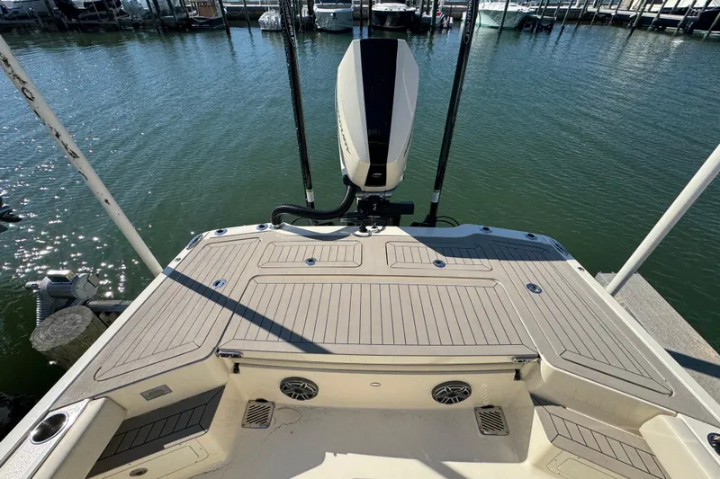  Yacht Photos Pics 2025 Scout 281 XSS boat deck with motor, docked at marina.